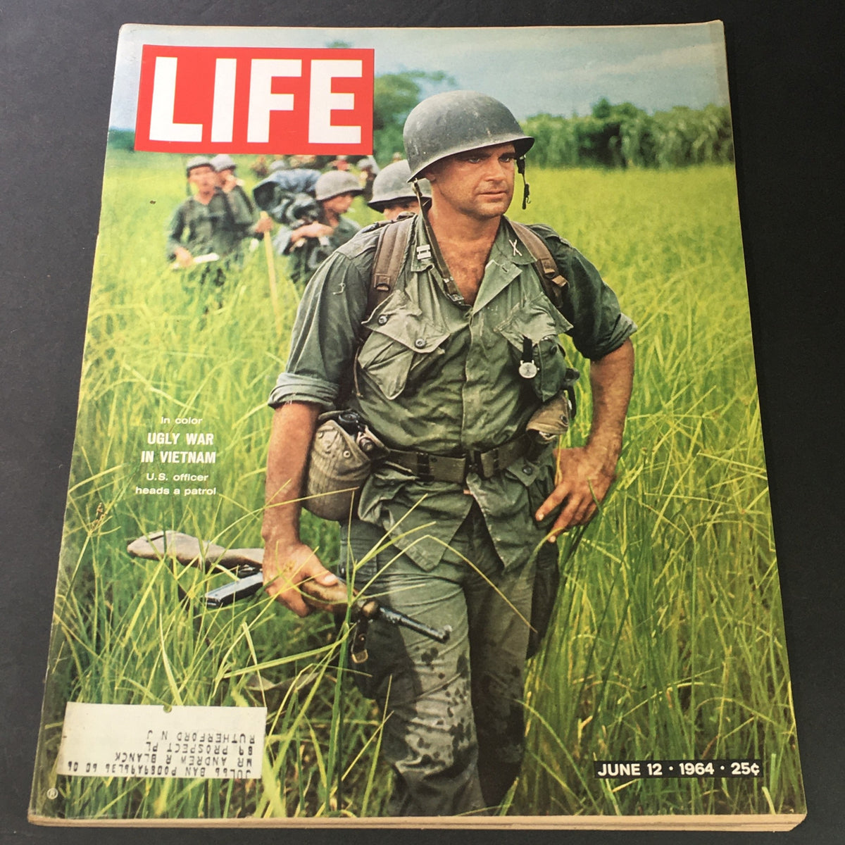 VTG Life Magazine June 12 1964 featuring an article about the Ugly War in Vietnam, showcasing a U.S. officer leading a patrol in a green field.