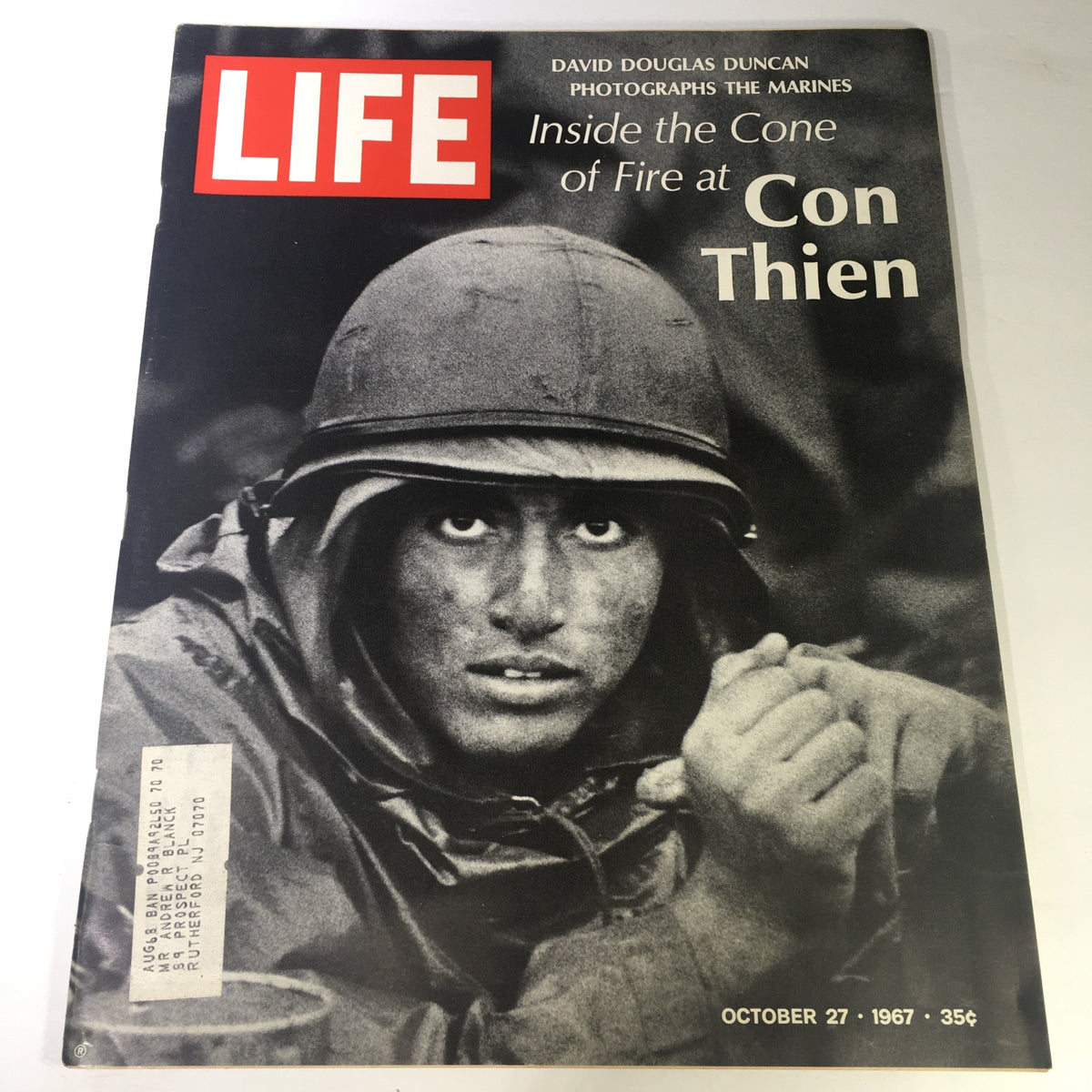 Cover of VTG Life Magazine October 27, 1967, featuring a powerful photograph by David Douglas Duncan of a soldier, illustrating the theme 'Inside the Cone of Fire at Con Thien', highlighting the Vietnam War era.