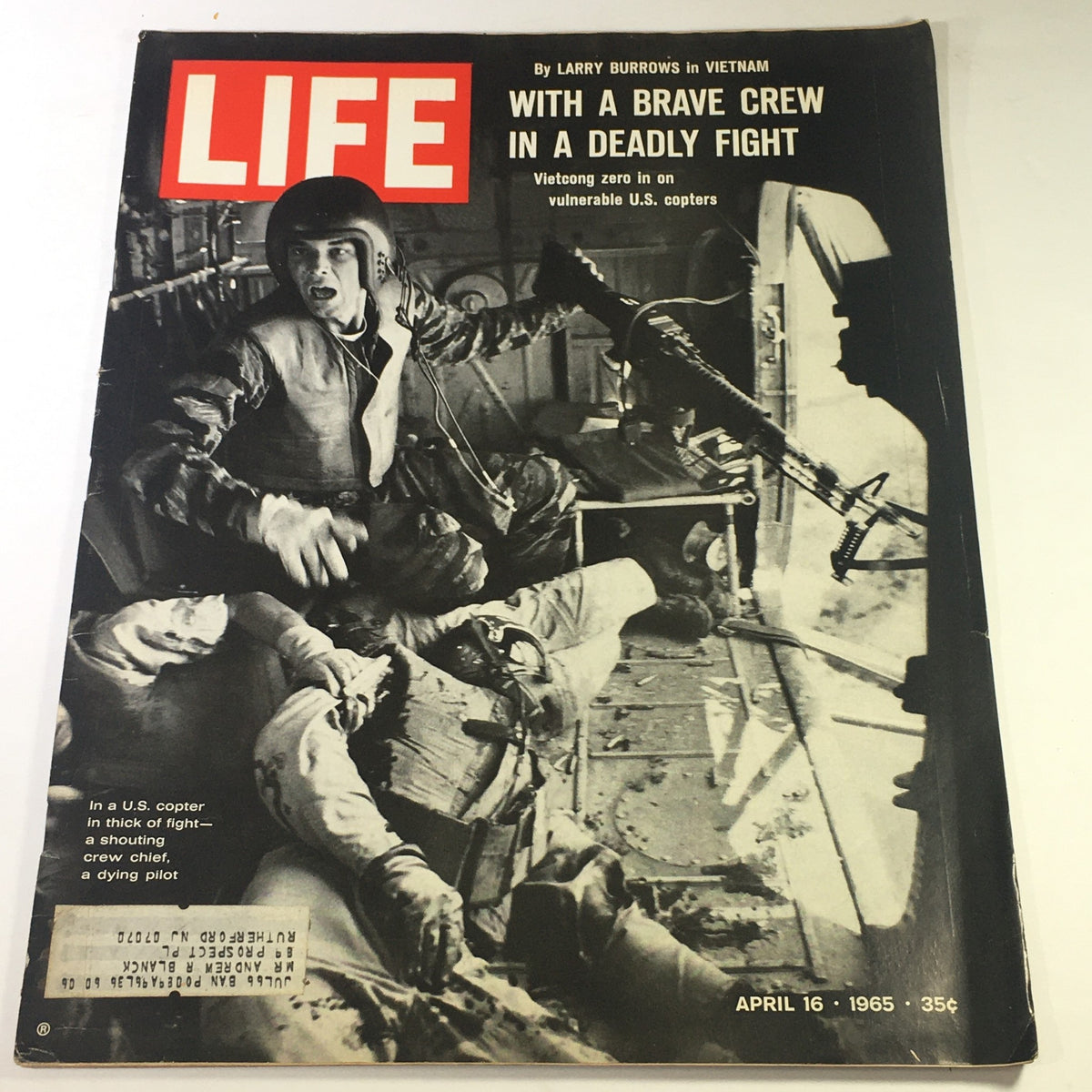 Cover of Life Magazine dated April 16, 1965 featuring the title 'With a Brave Crew in a Deadly Fight' by Larry Burrows, depicting a tense moment in a U.S. copter during combat, highlighting the heroism of soldiers in Vietnam.