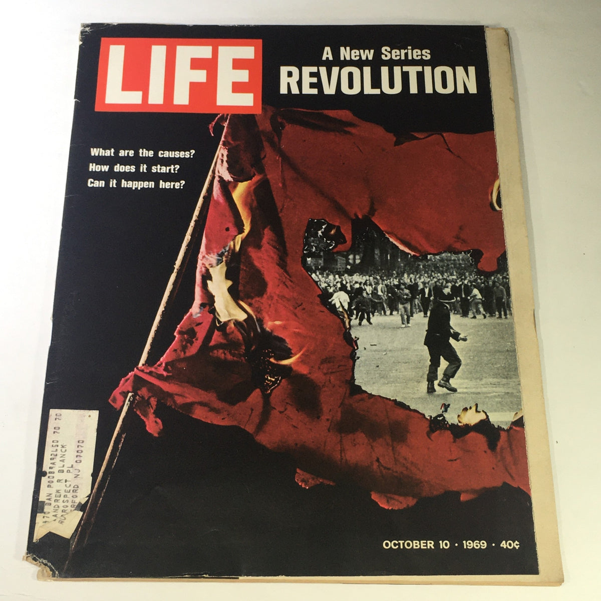 Cover of Life Magazine dated October 10, 1969, featuring the title 'A New Series of Revolution' with a striking image of red fabric and a crowd in the background, exploring themes of social change and unrest.