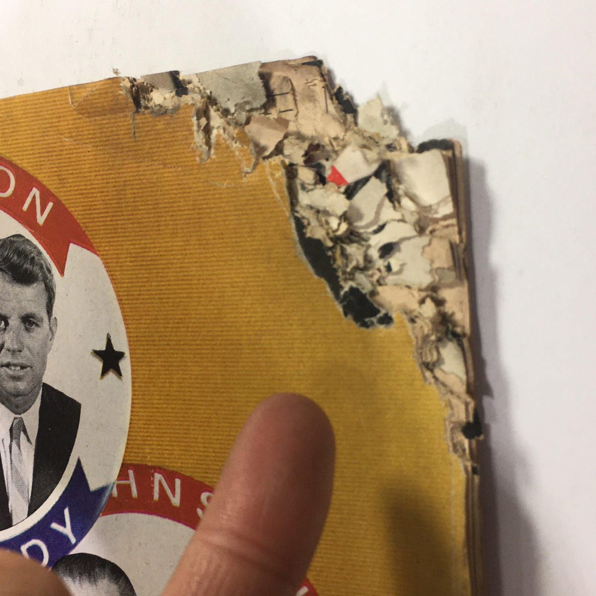 Close-up of the damaged edge of the VTG Life Magazine May 8 1964 showing wear and tear, including a torn cover featuring Robert Kennedy.
