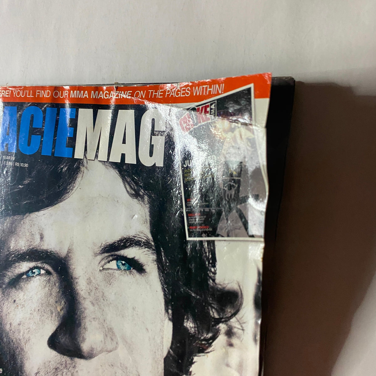 Close-up of the cover of Gracie Magazine October 2010 No. 162 highlighting an advertisement alongside the iconic image of Rolls Gracie.