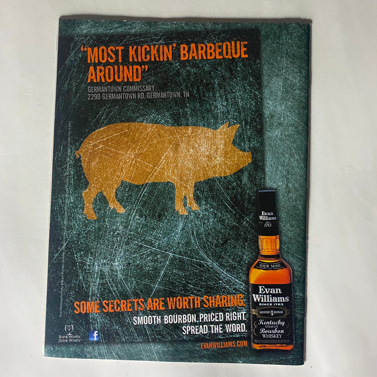 Back cover of Sports Illustrated Magazine February 13 2012 featuring an advertisement for Evan Williams Bourbon, showcasing a pig silhouette and a call to action for barbecue enthusiasts.