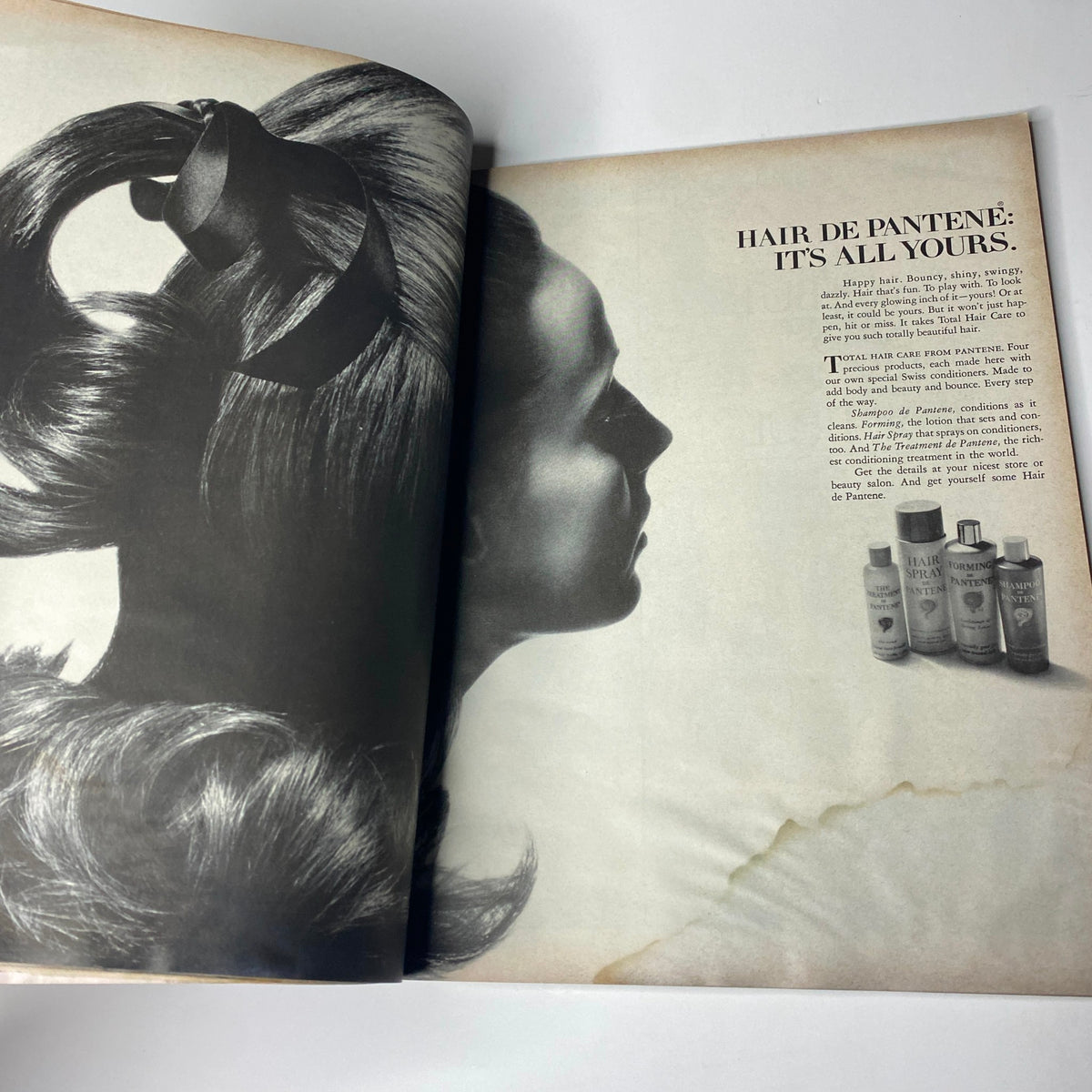 Vogue Magazine June 1969 page showcasing hair care products from Pantene, with a model presenting a classic hairstyle. This reflects beauty trends and hair care solutions of the time.