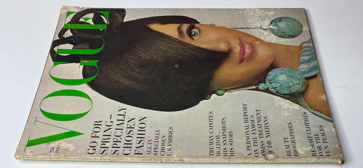 Vogue Magazine January 15, 1966 with Marisa Berenson cover art, displaying a vintage look with a distinct hairstyle, turquoise accessories, and references to famous fashion articles.