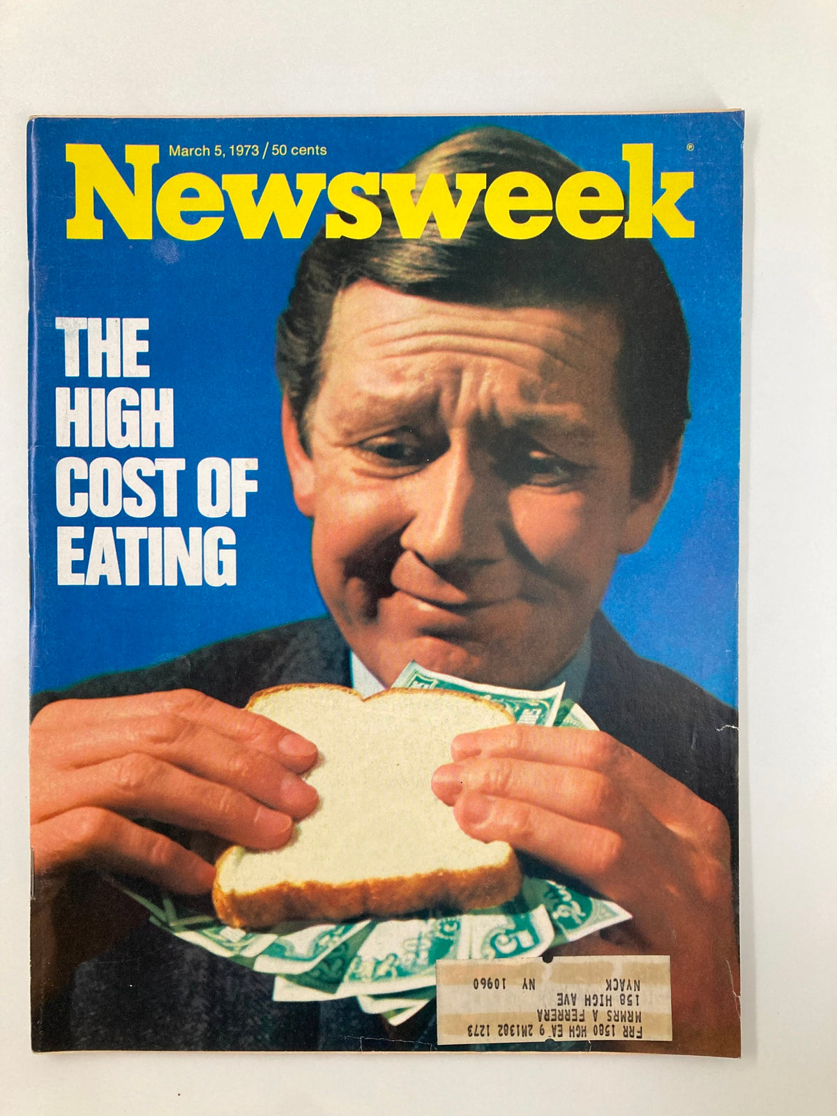 Cover of Newsweek Magazine from March 5, 1973, titled 'The High Cost of Eating', featuring a man holding a slice of bread and dollar bills, highlighting the economic challenges of food prices in the 1970s.