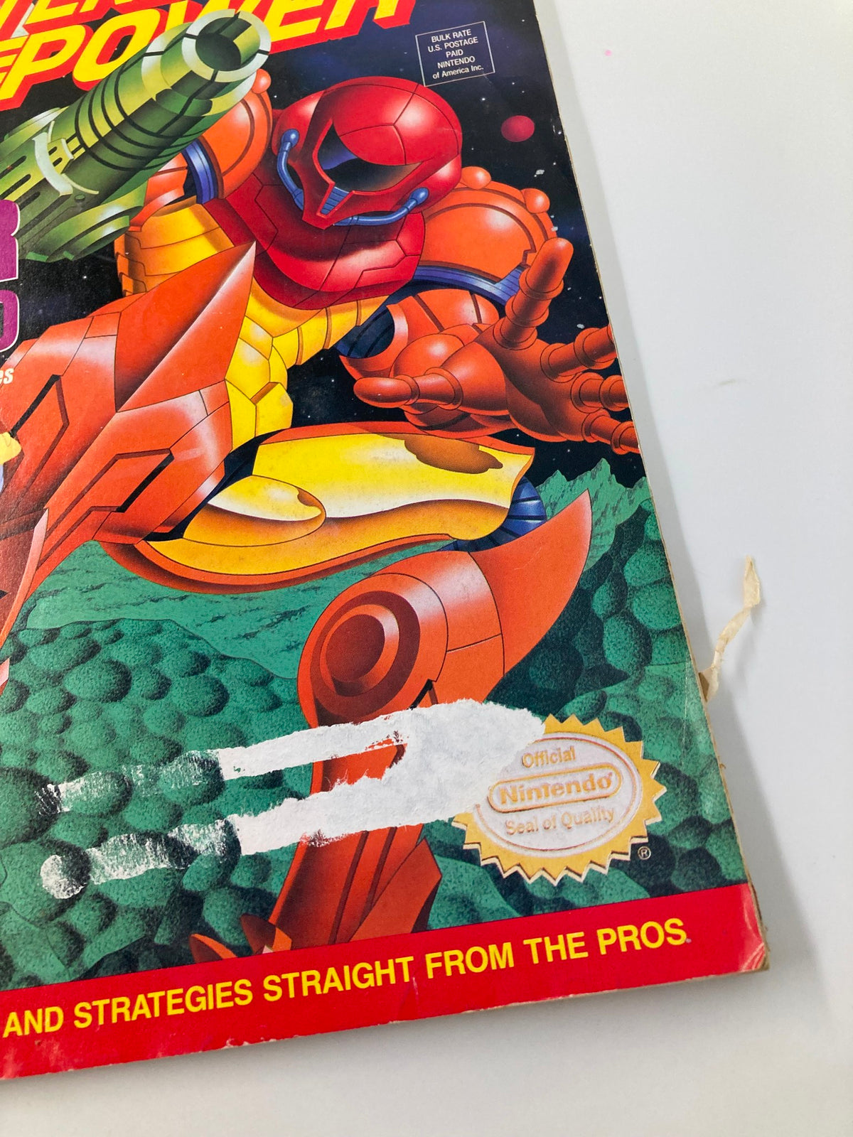Close-up of the cover of Nintendo Power Magazine May 1994 Vol. 60, emphasizing the Super Metroid graphic, the Nintendo Seal of Quality, and the bold text 'Massive Action, Mega Moves'.