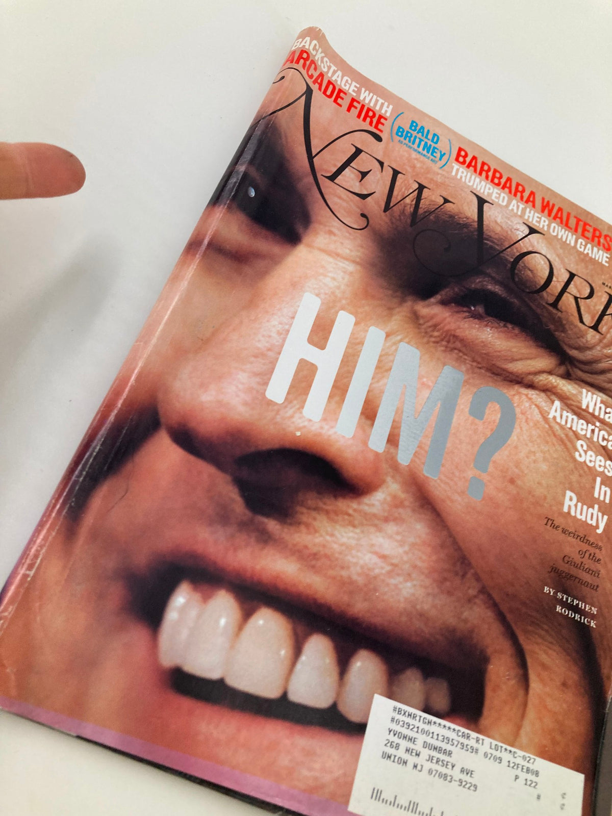 Close-up view of the cover of New York Magazine March 5 2007, showcasing the question 'HIM?' above a smiling Rudy Giuliani, part of the article 'What America Sees In Rudy' by Stephen Rodrick.