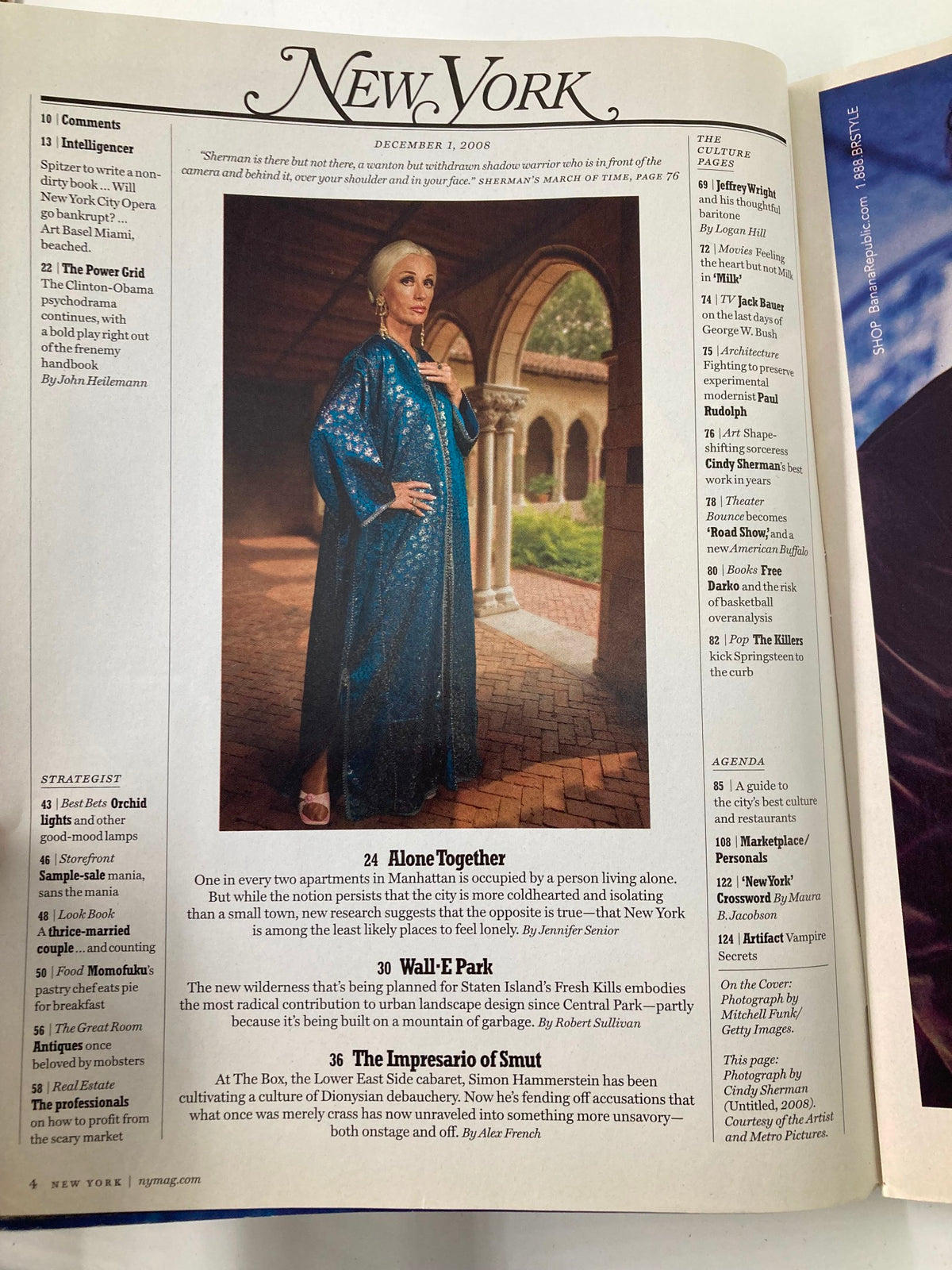 Interior page of New York Magazine, December 1, 2008, showcasing the article 'Alone Together' with a woman in a blue gown, highlighting societal themes of living alone and community dynamics.