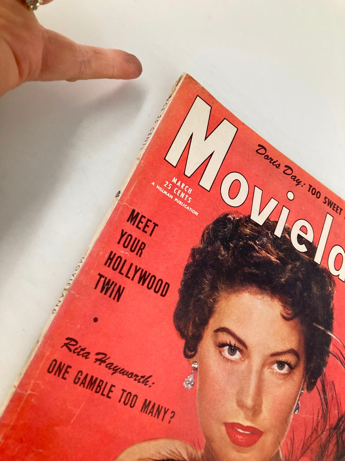 VTG Movieland Magazine March 1954 close-up of the cover, highlighting Ava Gardner with feather boa and text about Rita Hayworth.