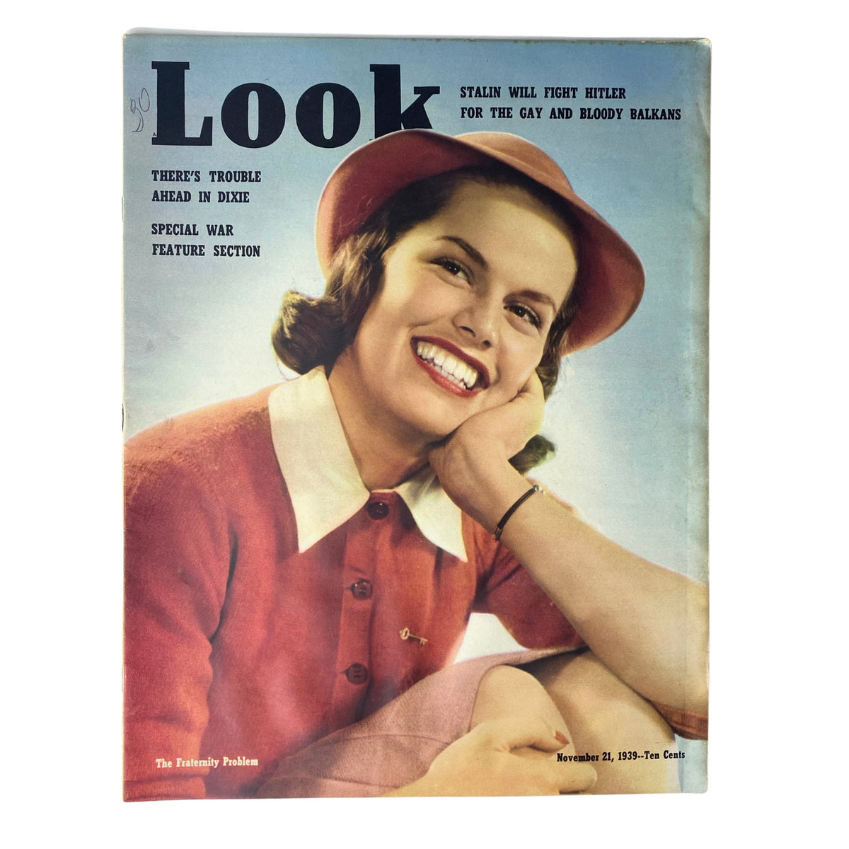 Cover of Look Magazine, November 21, 1939 featuring the article 'The Fraternity Problem', showcasing a smiling woman dressed in a red blouse and hat against a blue background.