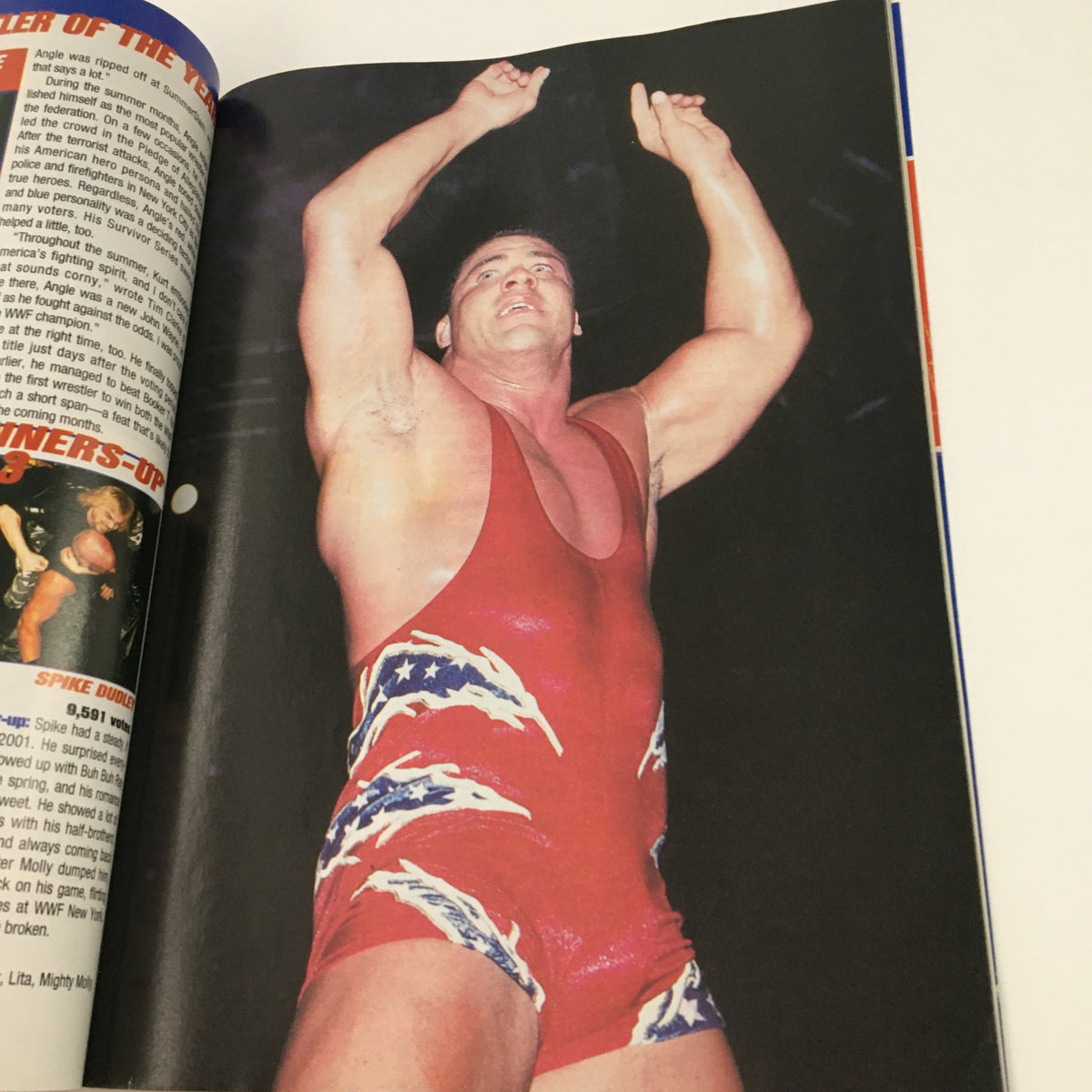 Image of a wrestler in action featured in Pro Wrestling Illustrated Magazine April 2002, showcasing athleticism and wrestling attire.