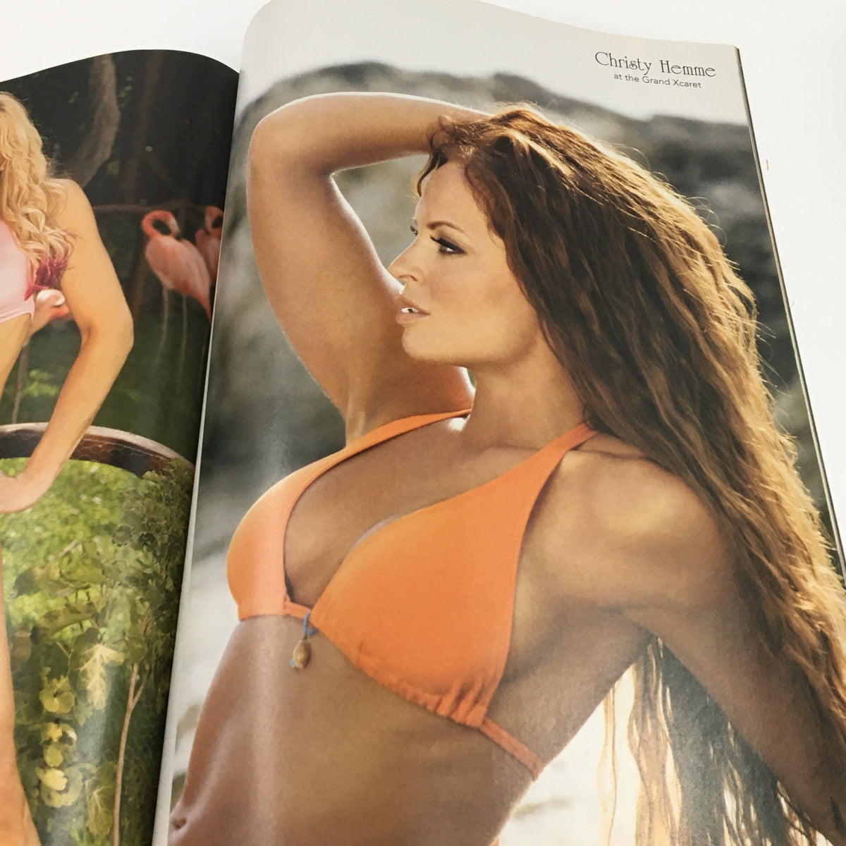 WWE Divas Magazine 2005 highlighting Christy Hemme posing in an orange bikini, embodying the spirit of the wrestling divas era alongside Trish Stratus.