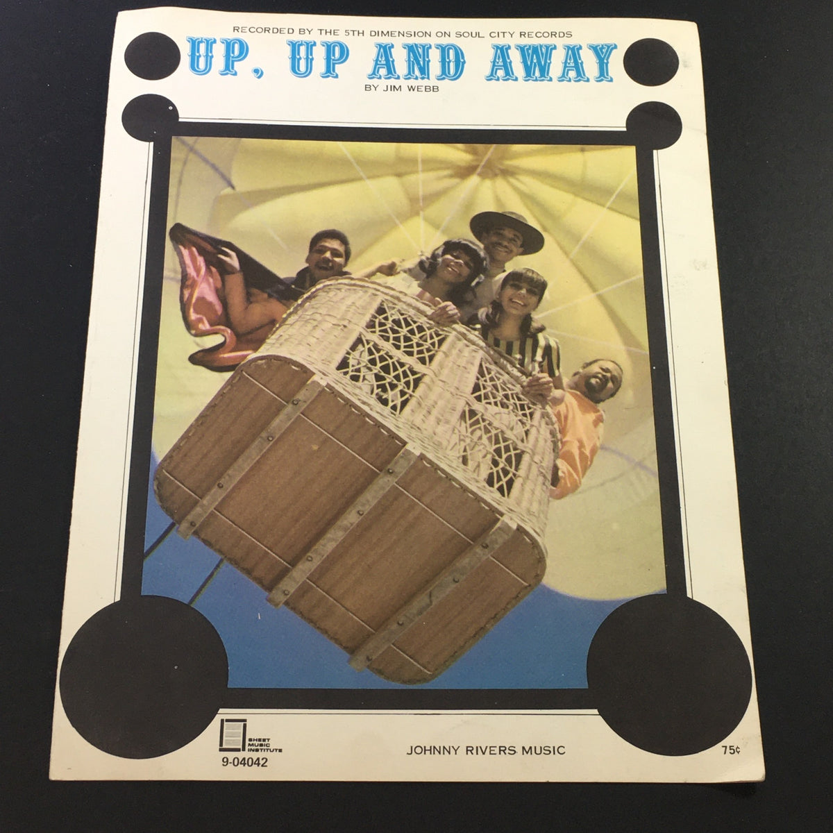 Vintage music sheet cover of 'Up, Up and Away' by Jim Webb, featuring a colorful image of a hot air balloon with smiling individuals, recorded by Johnny Rivers Music.