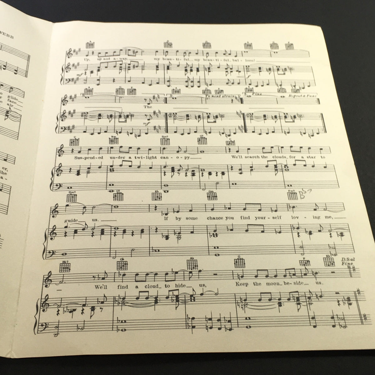 Sheet music pages from 'Up, Up and Away' by Jim Webb, showcasing lyrics and musical notes for an authentic vintage music experience.