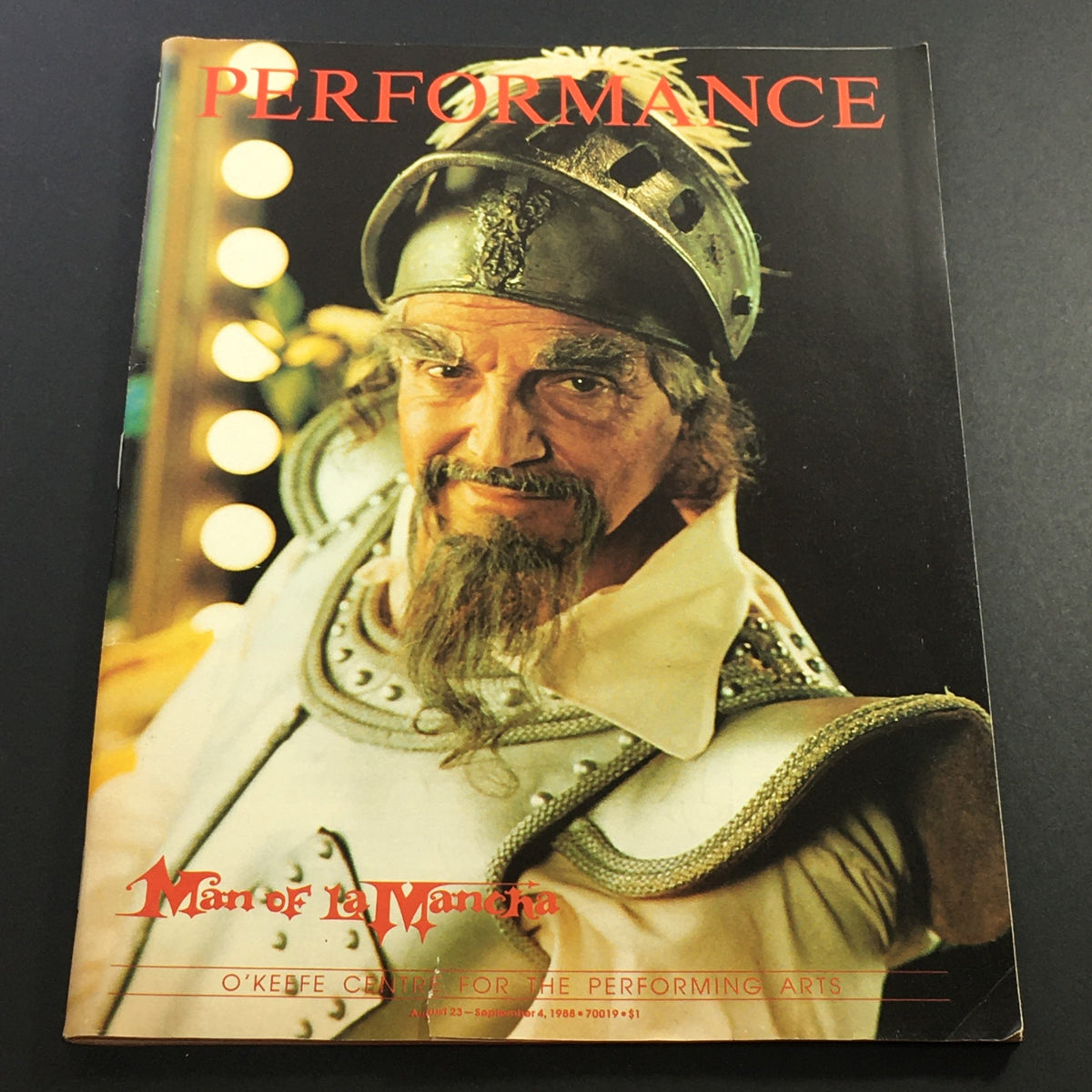 Cover of the VTG Performance Theatre Magazine featuring the title 'Man of La Mancha' from August 23 to September 4, 1988, showcasing a prominent character in costume. This vintage issue highlights one of the iconic productions in theater history.