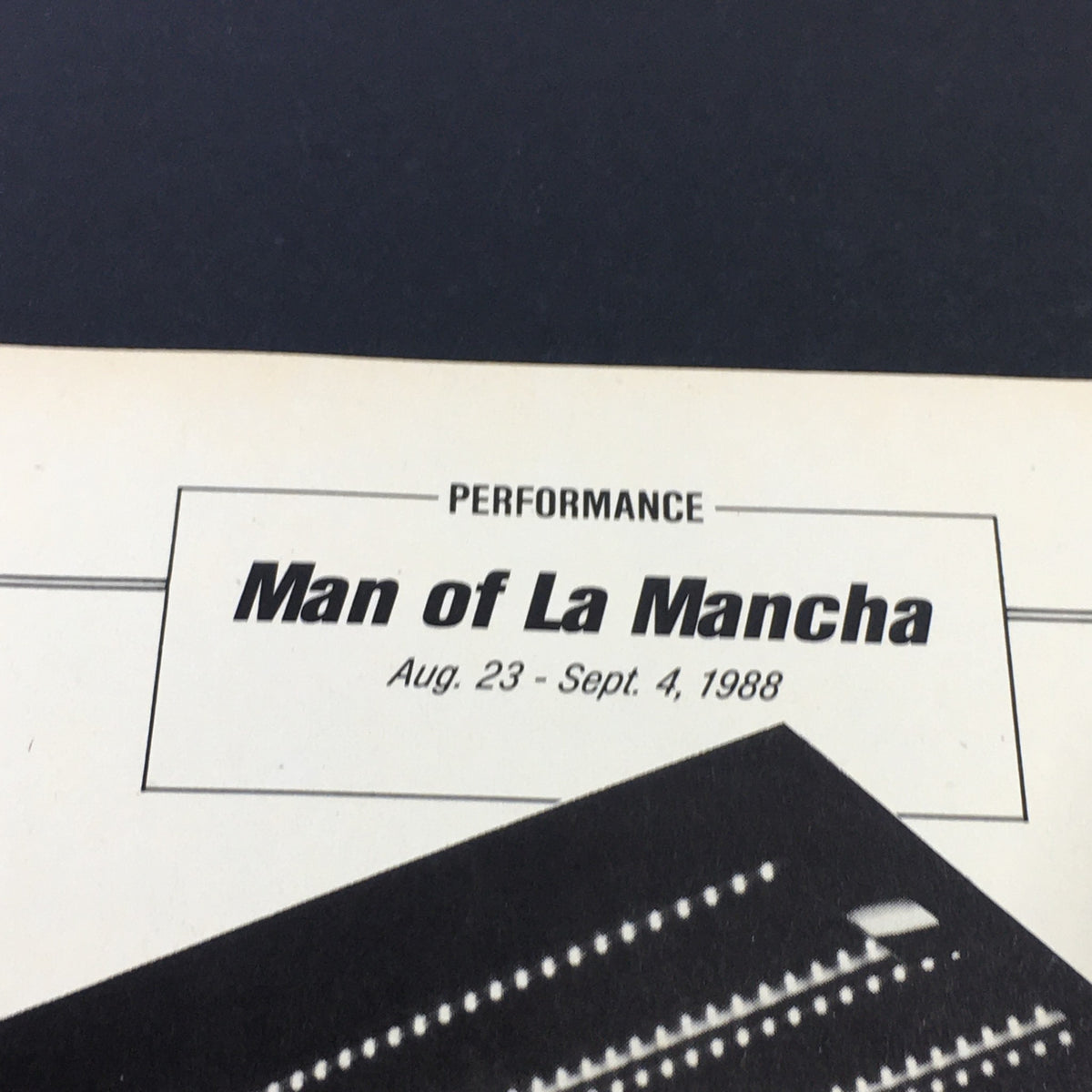Interior page of the VTG Performance Theatre Magazine displaying the title 'Man of La Mancha' along with the performance dates of August 23 to September 4, 1988. This detail provides insight into the theater's promotional materials.