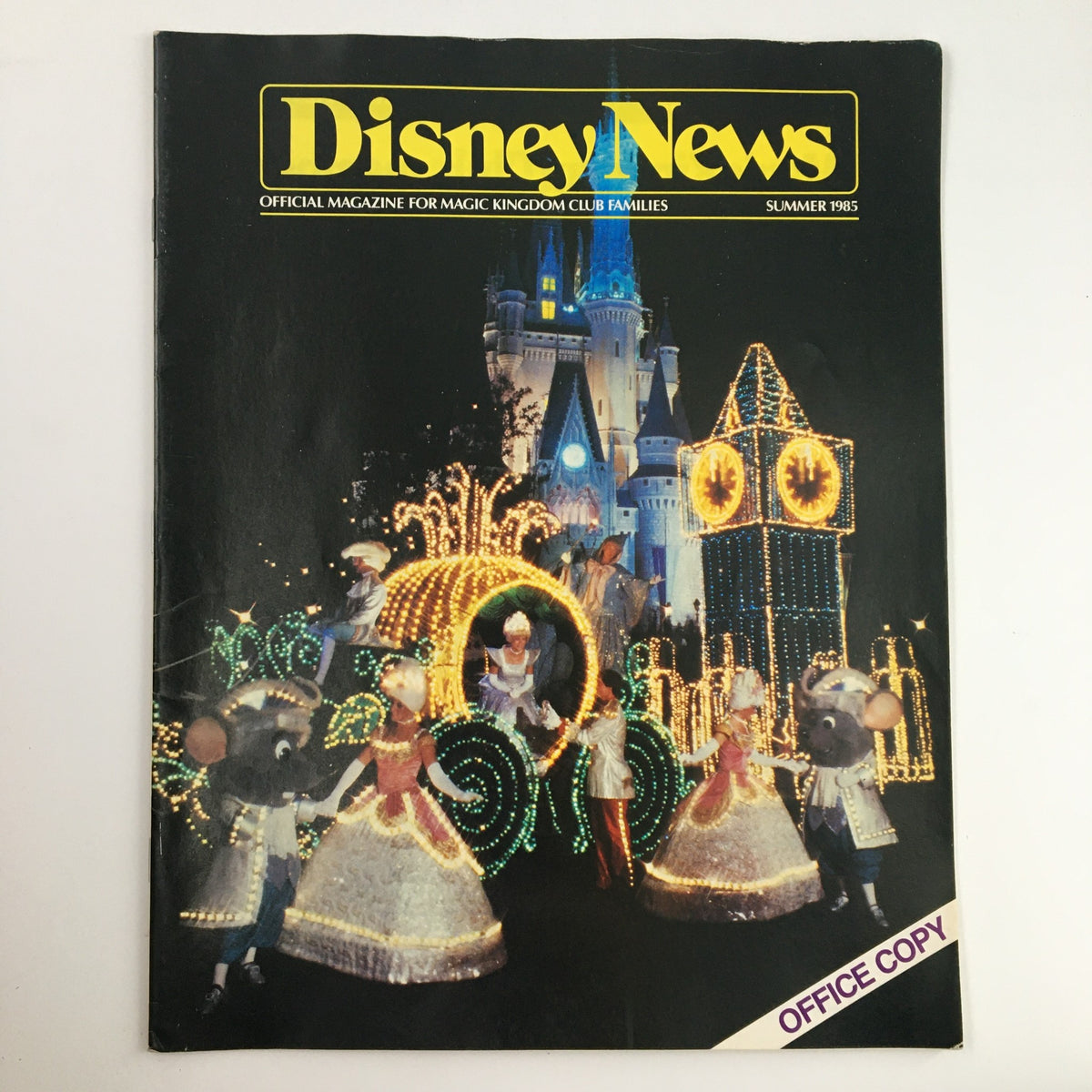 Cover of Disney News Magazine Summer 1985 featuring festive Cinderella and a lighted castle, highlighting the enchanting Disney atmosphere of the 1980s.