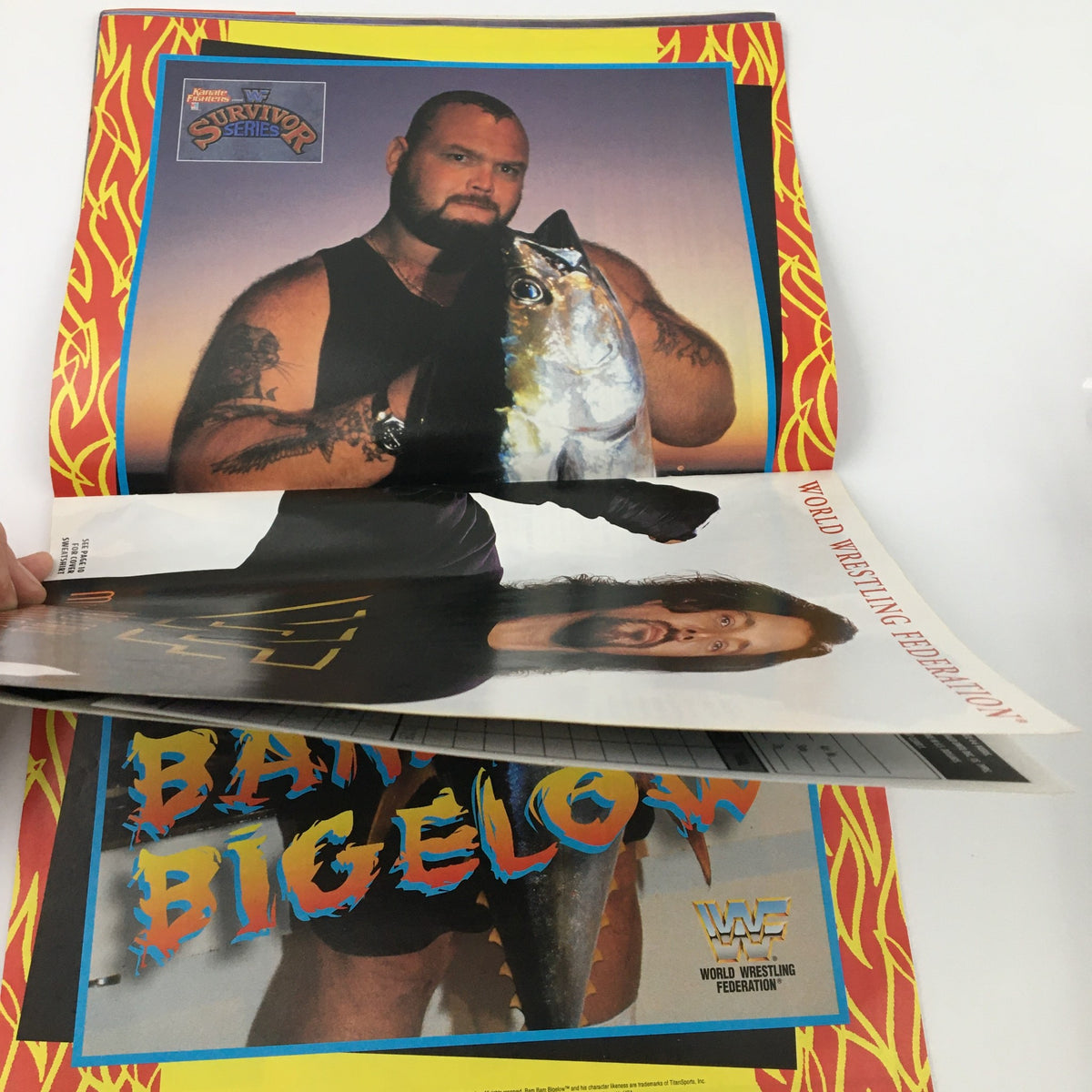 Page showcasing Bam Bam Bigelow from WWF Magazine November 1995, holding a large fish, illustrating the magazine's fun features.