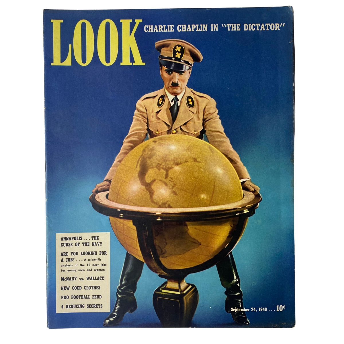 Cover of Look Magazine dated September 24, 1940 featuring Charlie Chaplin in a military uniform standing on top of a globe, promoting his movie 'The Great Dictator'. A vintage magazine in very good condition.