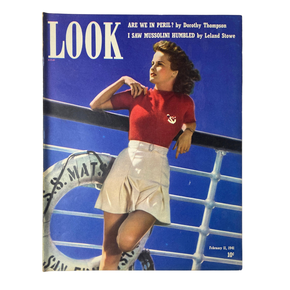 Look Magazine February 11, 1941 cover featuring the headline 'I Saw Mussolini Humbled' by Leland Stowe, depicting a woman in a red top and white skirt against a blue background.