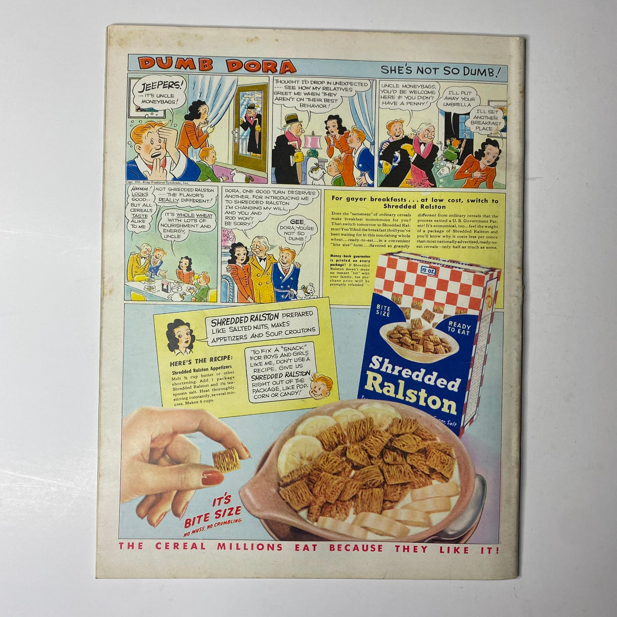Back cover of Look Magazine, April 8, 1941, featuring a comic strip 'Dumb Dora' and an advertisement for Shredded Ralston cereal.