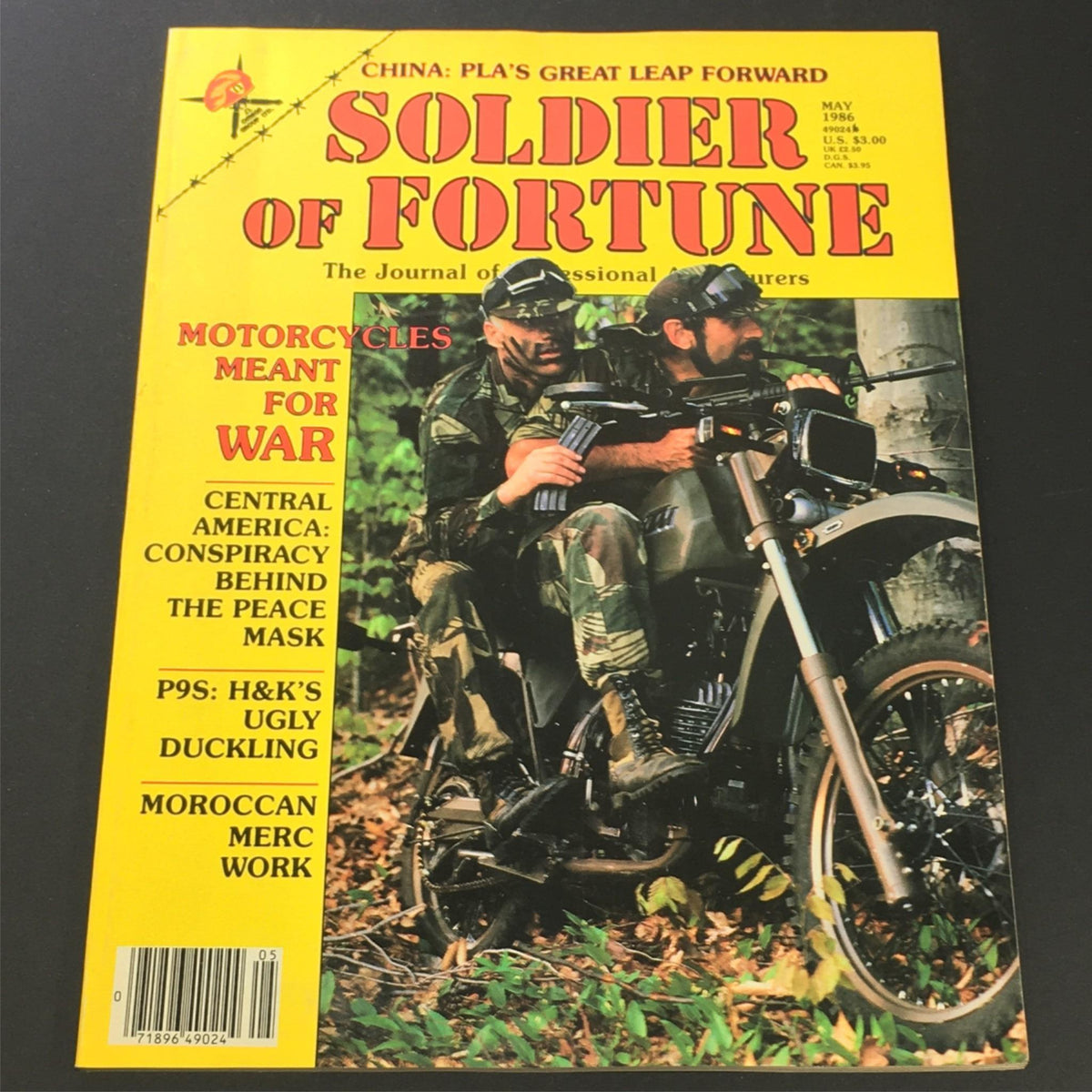 Cover of the VTG Soldier of Fortune Magazine May 1986 edition featuring a military motorcycle, with the title 'Motorcycles Meant for War' prominently displayed.
