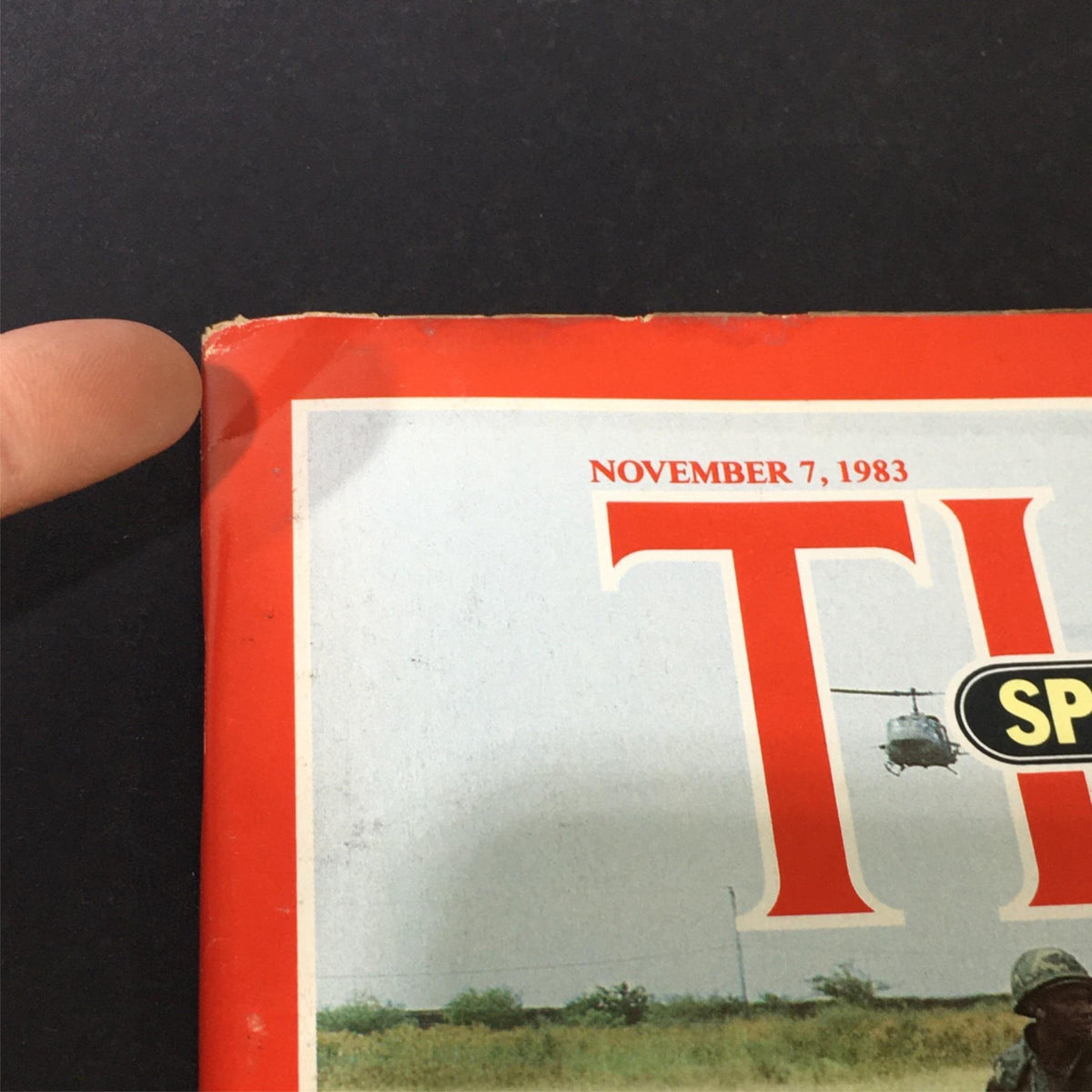 Close-up view of the corner of the VTG Time Magazine from November 7, 1983, showcasing the title 'TIME' and date, highlighting minor wear on the cover.