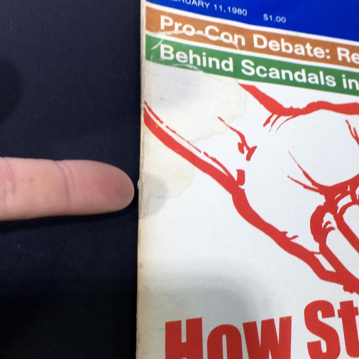Close-up view of the side edge of the VTG US News & World Report magazine dated February 11, 1980, featuring the title 'How Strong is Russia?' The image shows minor wear on the cover, highlighting its vintage condition.