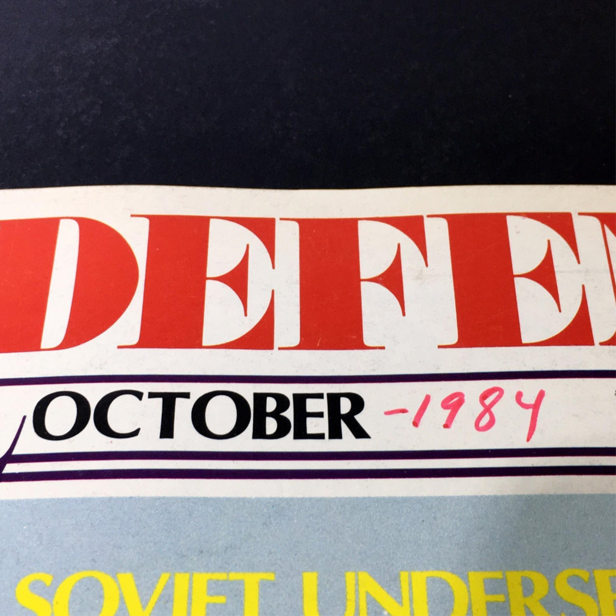 Close-up of the title 'Defense' from VTG Strategy & Defense Magazine October 1984, highlighting the month and year of publication.