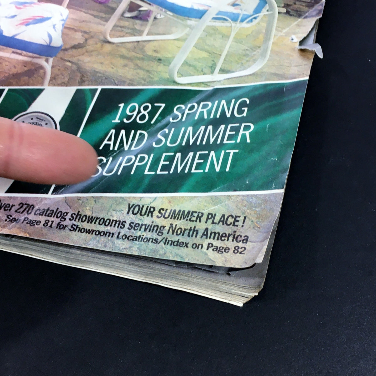 VTG Consumers Catalog Showroom 1987 Spring & Summer Supplement featuring a close-up of the catalog's cover, highlighting the title and an image of patio chairs.