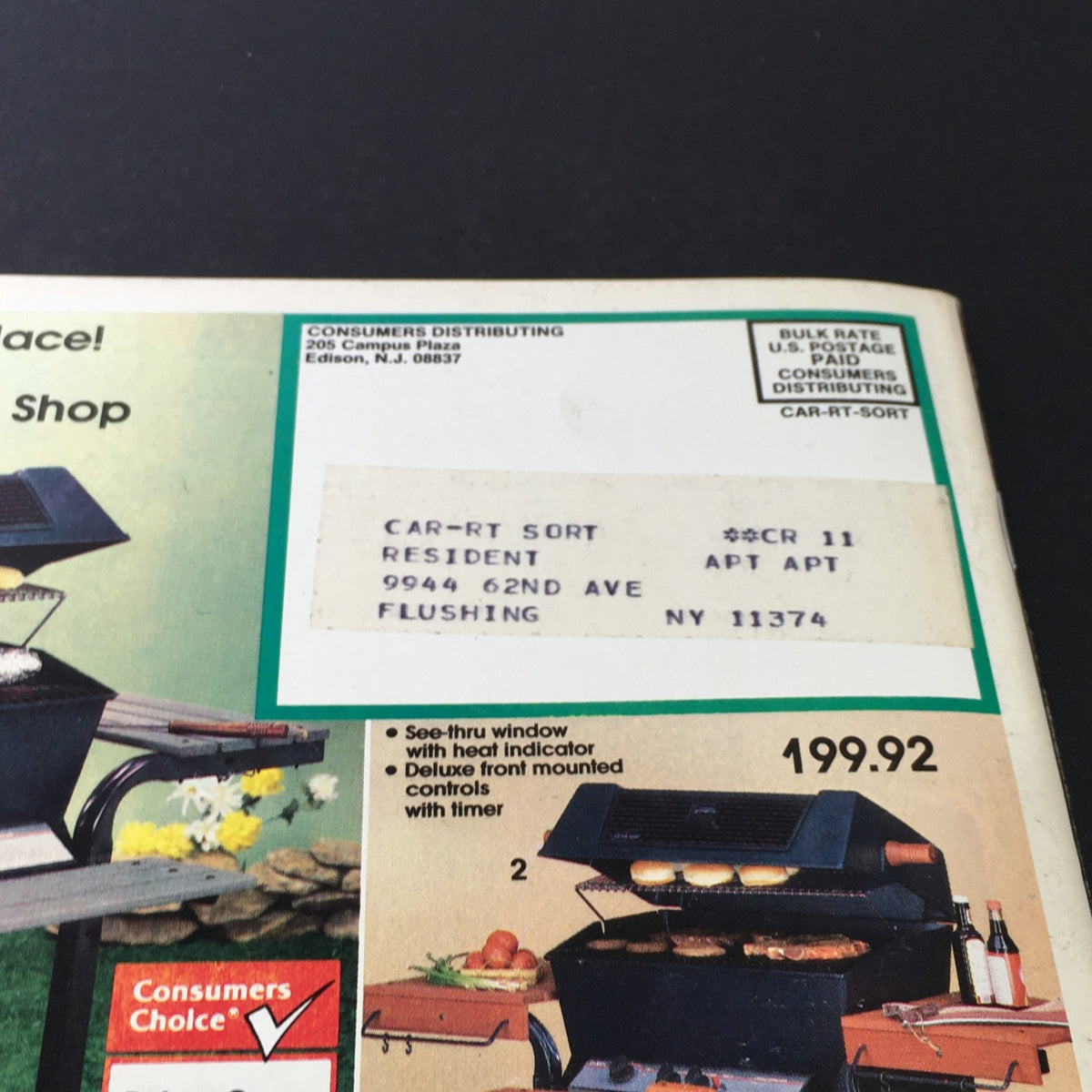 VTG Consumers Catalog Showroom 1987 Spring & Summer Supplement showcasing a consumers distributing catalog cover with an address label, featuring images of a barbecue grill and shopping details.