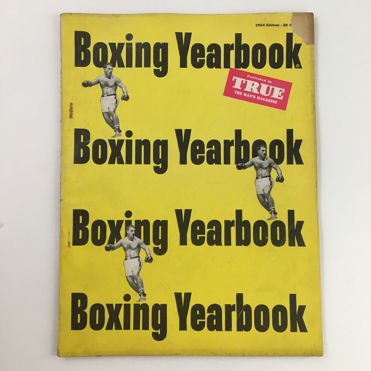 Cover of True Magazine 1954 Boxing Yearbook titled 'The Legend of Primo Carnera', featuring bold black text on a yellow background and images of boxers.
