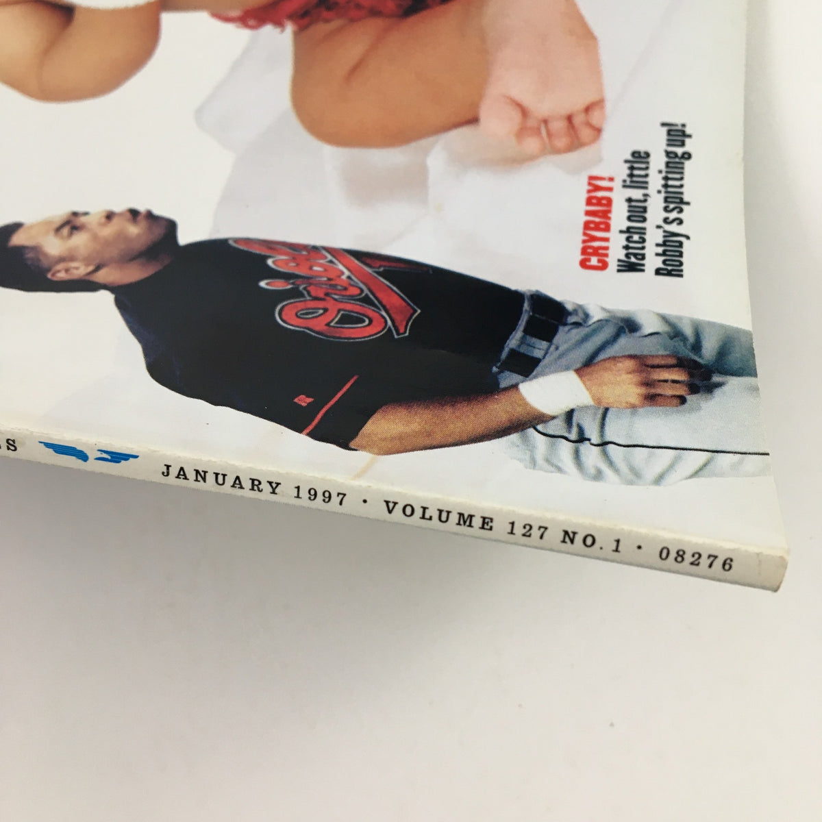 Side view of Esquire Magazine January 1997 showcasing the issue's details including volume and date information, with a focus on the decorative elements and age wear.