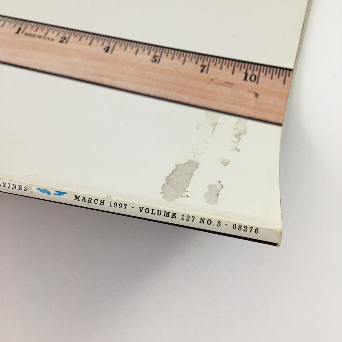 Spine view of Esquire Magazine, March 1997, displaying the publication date and volume number.