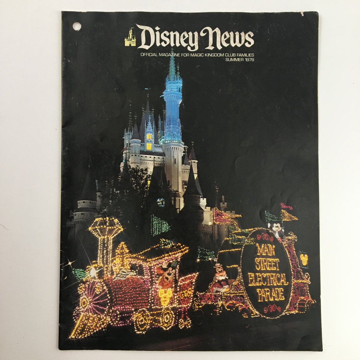 Cover of Disney News Magazine Summer 1978, featuring the Dazzling Main Street Electrical Parade with a brightly lit train and Cinderella Castle in the background.