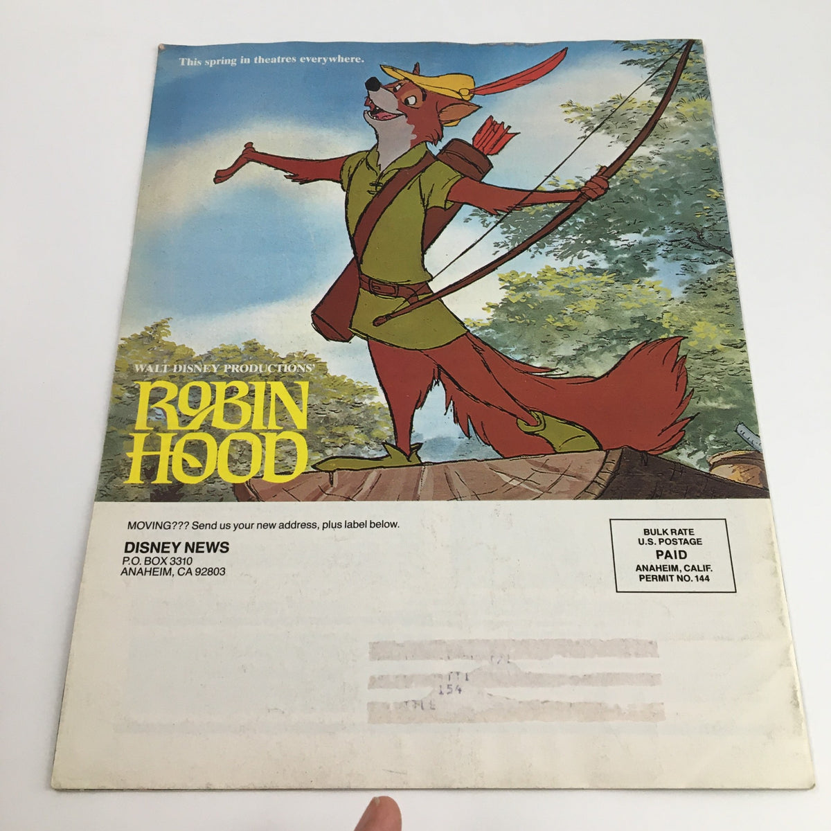 Back cover of Disney News Magazine Spring 1982 highlighting Robin Hood in vibrant artwork, promoting the animated classic and capturing the essence of Disney creativity.