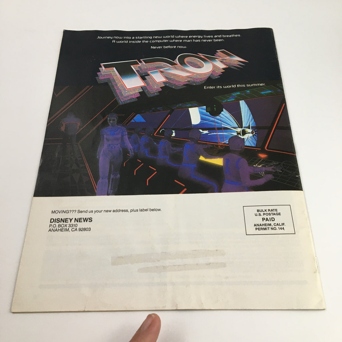 Back cover of Disney News Magazine Summer 1982 featuring the promotional artwork for the movie Tron, emphasizing Disney's innovation in entertainment during the era.