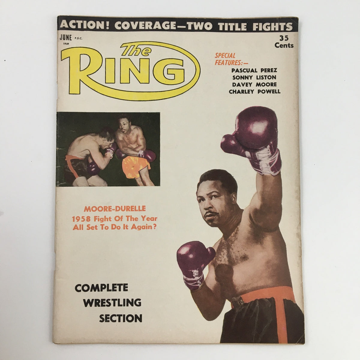 Cover of The Ring Boxing Magazine June 1959 featuring Yvon Durelle vs Archie Moore, showcasing boxing action and historic highlights.