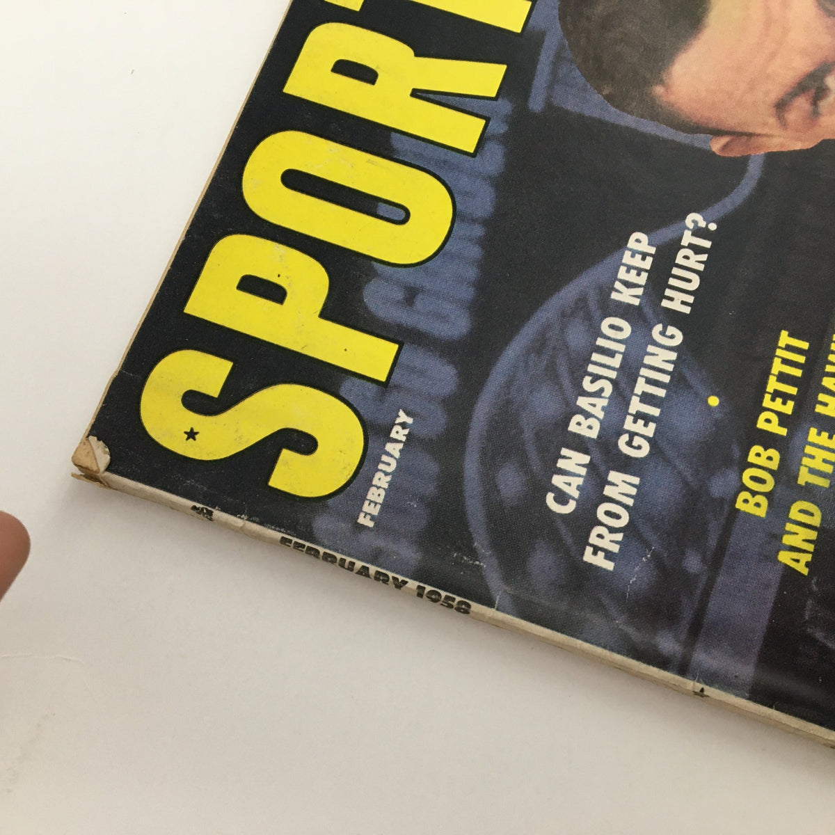 Cover of Sport Magazine February 1958 featuring bold headlines and iconic sports imagery, showcasing Bob Pettit, Carmen Basilio, and Robin Roberts.
