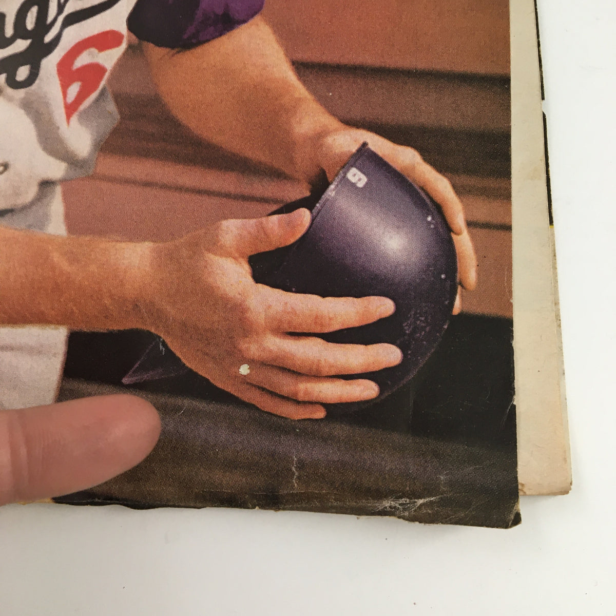 Close-up of Ron Fairly's hands holding a batting helmet on the cover of Sports Illustrated Magazine September 2 1963.