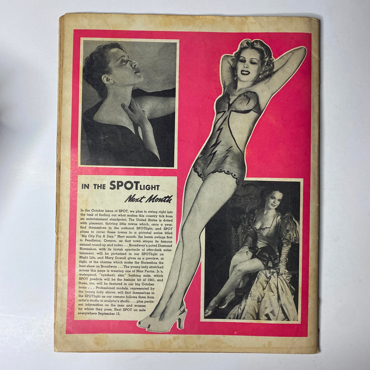 Back cover of Spot Magazine September 1940 featuring a stunning pin-up model and an advertisement for next month's issue, with a vibrant pink design.