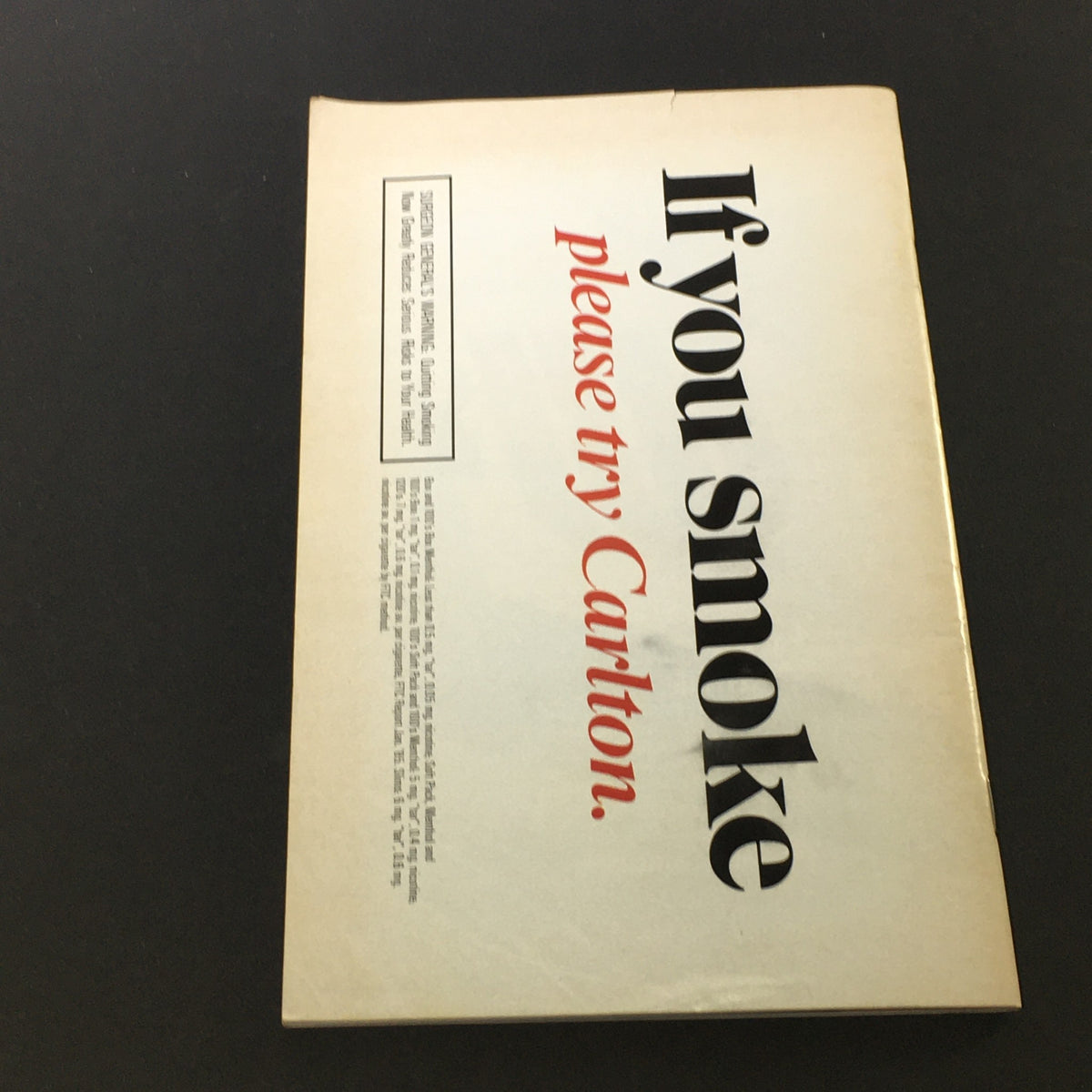 Vintage advertisement from the back cover of a stagebill for Cats by Andrew Webber at the VTG Shubert Theatre, November 1985, showcasing a tagline with a white background and striking font.