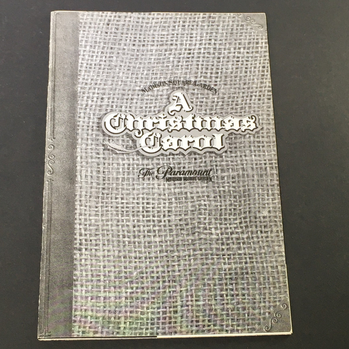 Cover of vintage magazine titled 'A Christmas Carol' from The Paramount Madison Square Garden 1995, showcasing a decorative design and nostalgic theme.