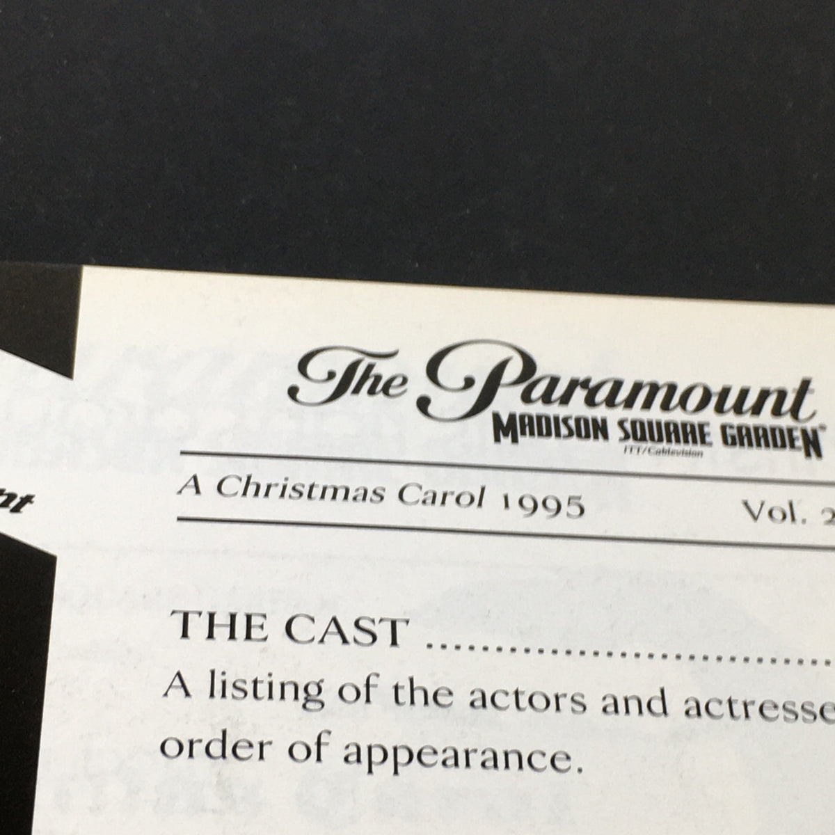 Page from the vintage magazine 'A Christmas Carol' from The Paramount Madison Square Garden 1995, featuring the cast listing and historical details about the production.