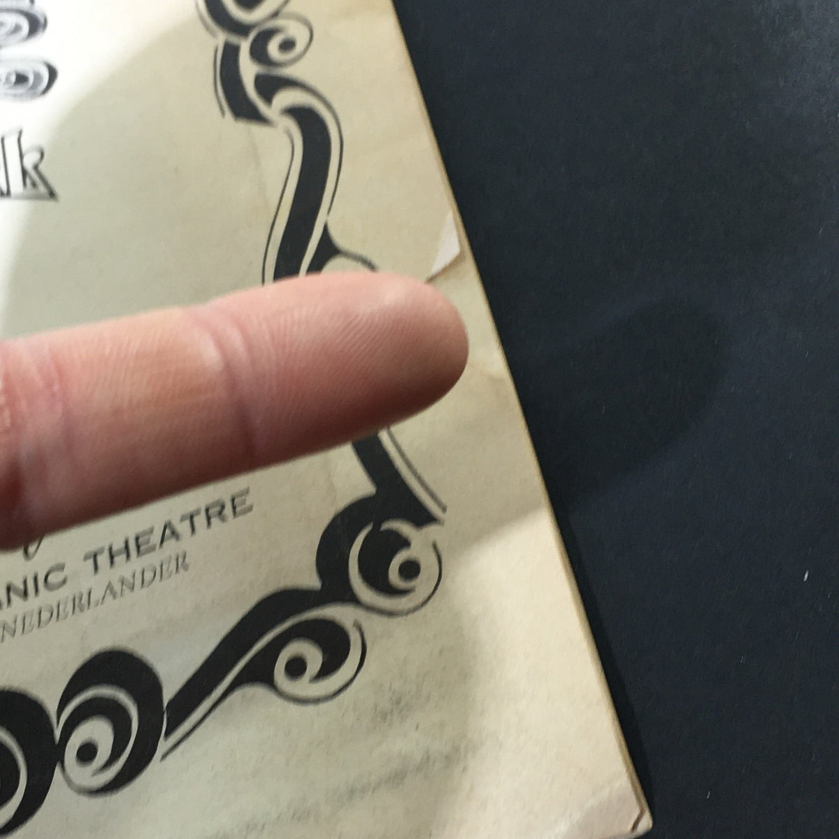 Close-up of the cover of VTG The Playgoer December 1973, showing a slight rip and artistic detailing around the title Godspell Musical by Nina Faso.