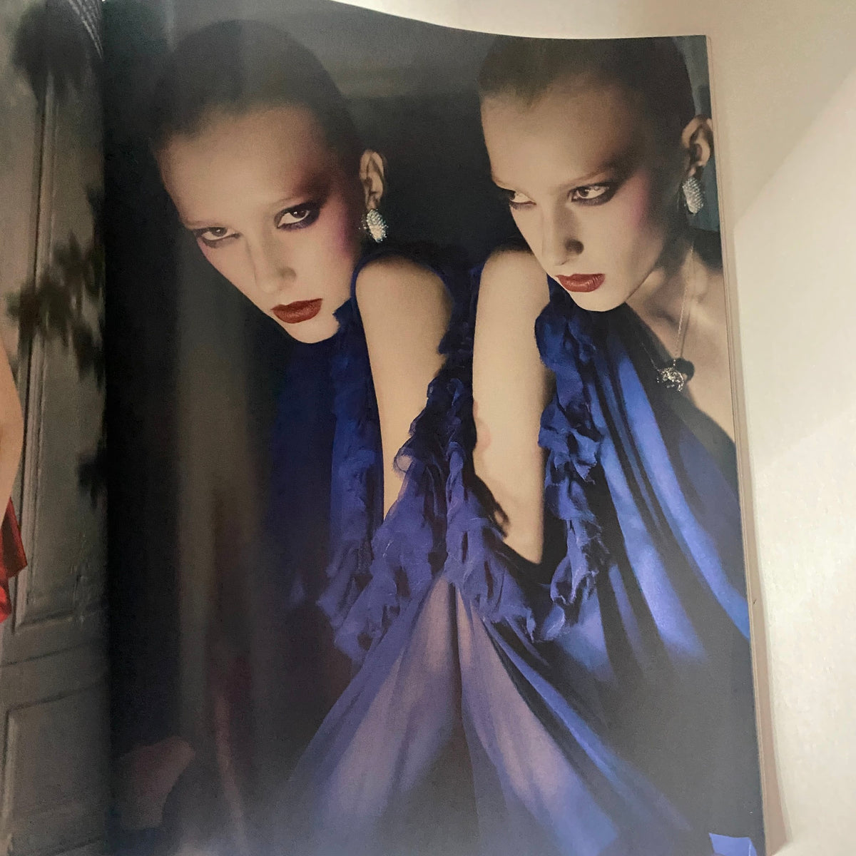 Stunning fashion editorial from Numéro Magazine October 2009 No. 107 showcasing models in dramatic blue attire with striking makeup and accessories.