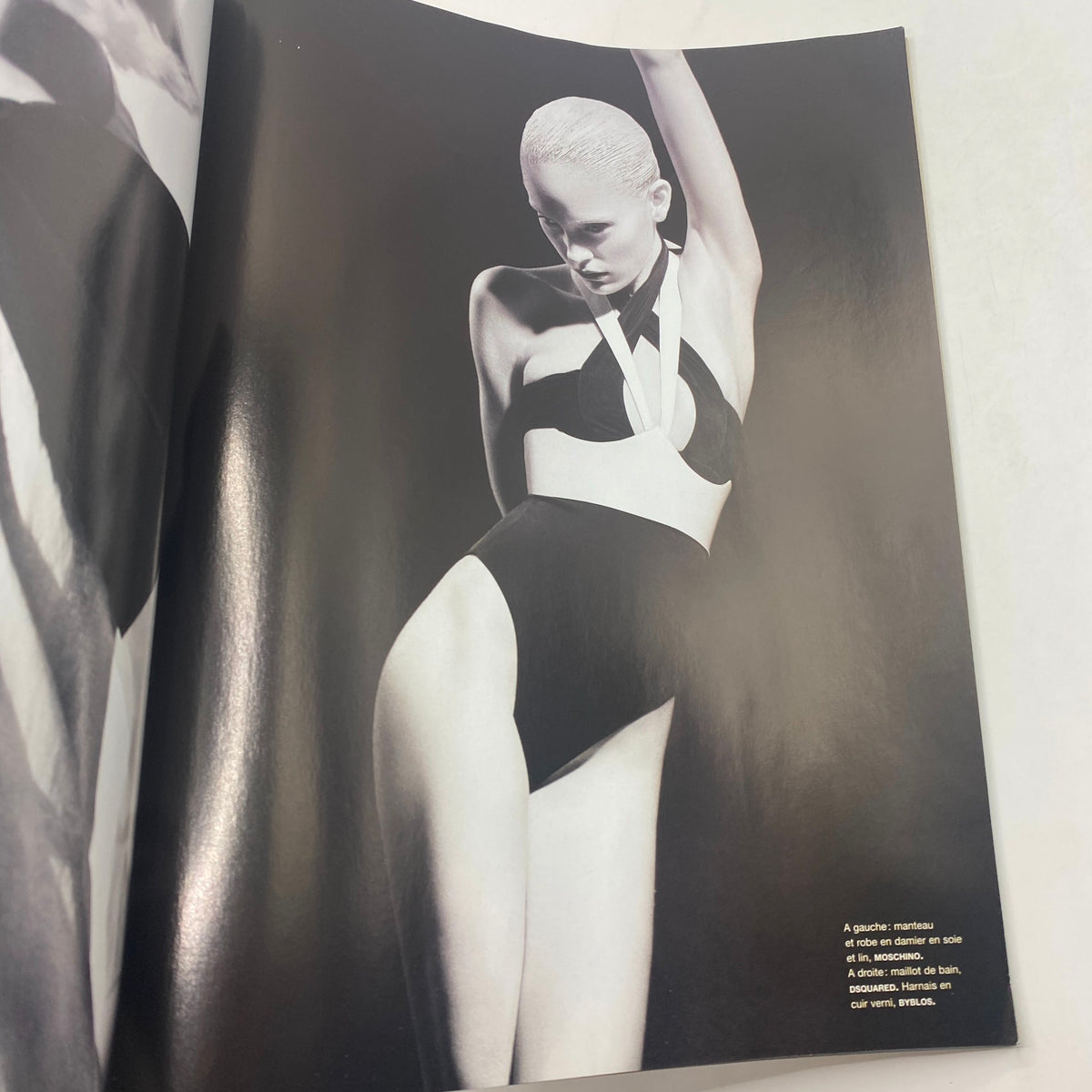 Artistic black and white photograph from Numéro Magazine April 2009 No. 102, featuring a model in a chic swimsuit, representing high-fashion photography.