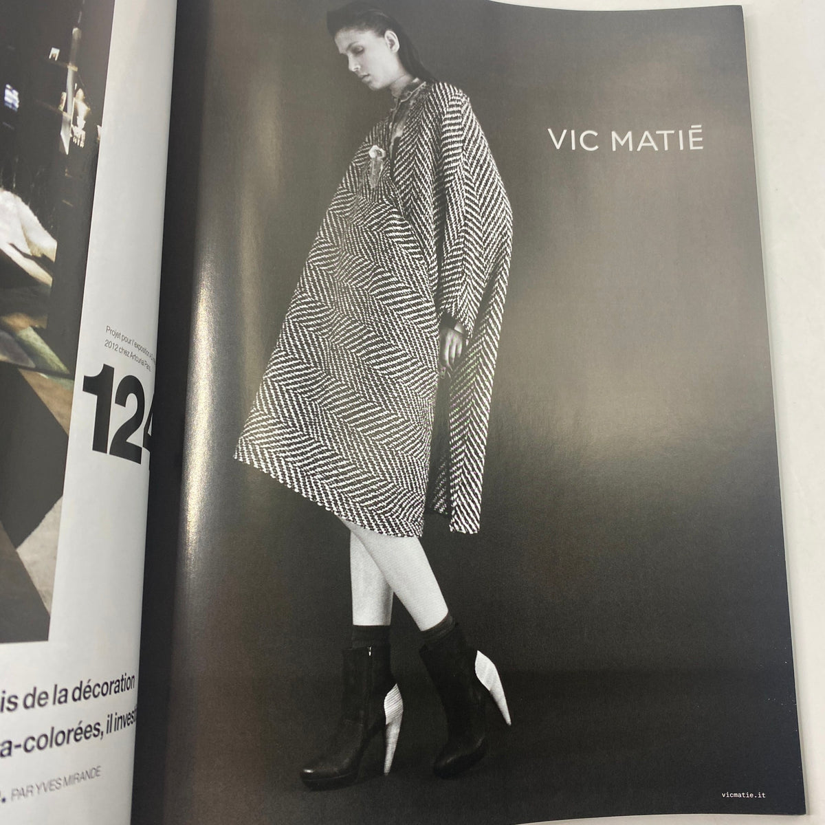 Fashion editorial page from Numéro Magazine October 2012 No. 137 featuring a model in a striking black and white outfit by Vic Matié, representing modern fashion trends.
