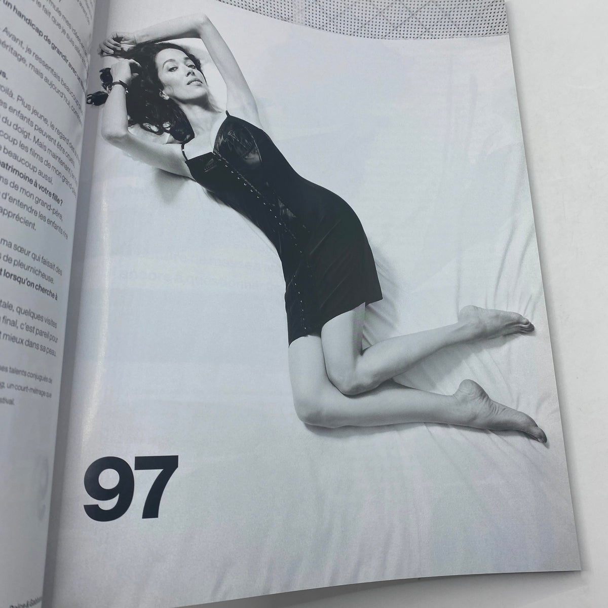 Interior page of Numéro Magazine September 2013 No. 146 displaying a stunning black and white fashion photograph of a model posed in a seductive dress.
